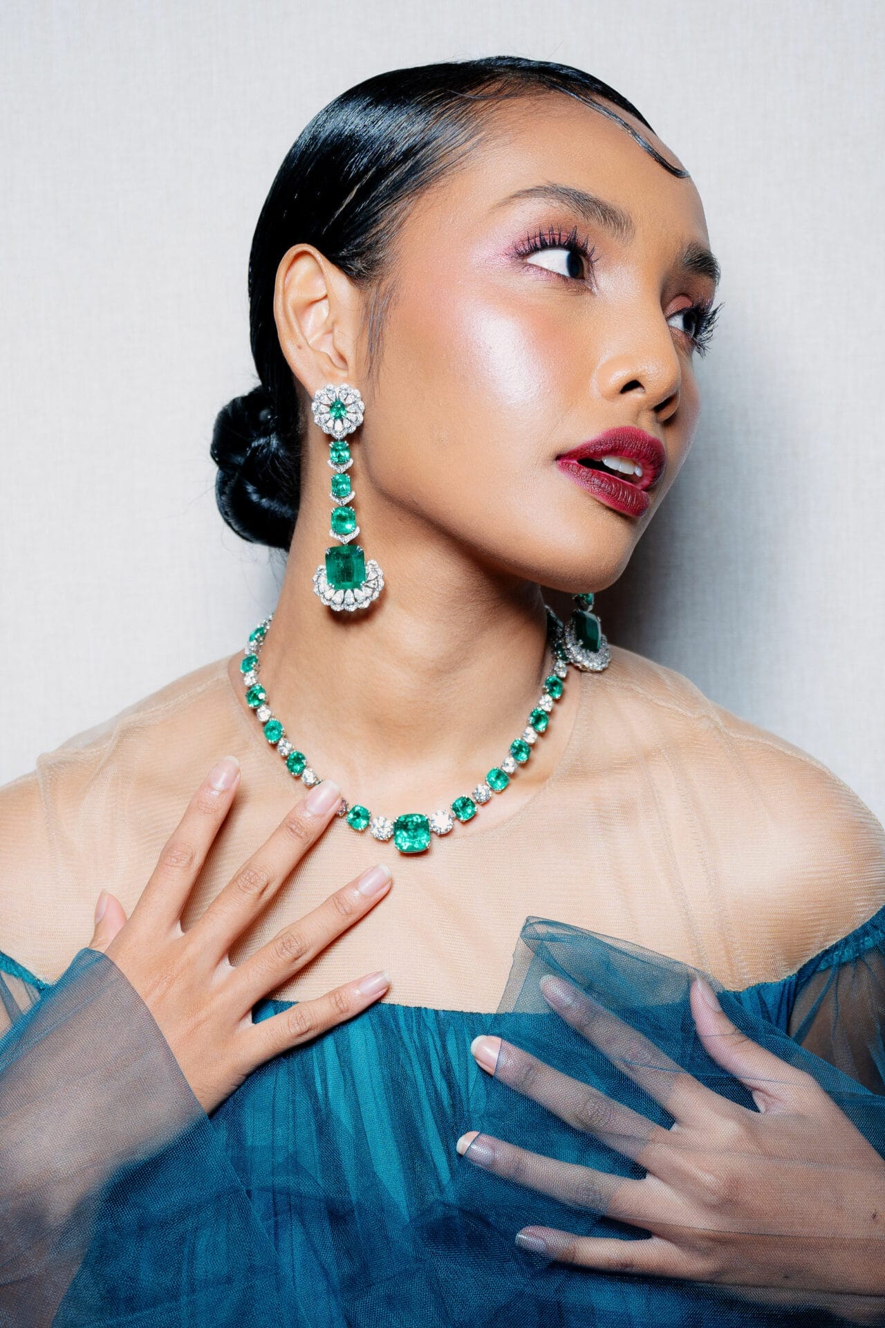 Model with our Muzo Emerald High Jewellery Set